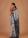 Graceful White Base Saree with Black Floral Pattern – Elegant, Feminine & Stylish